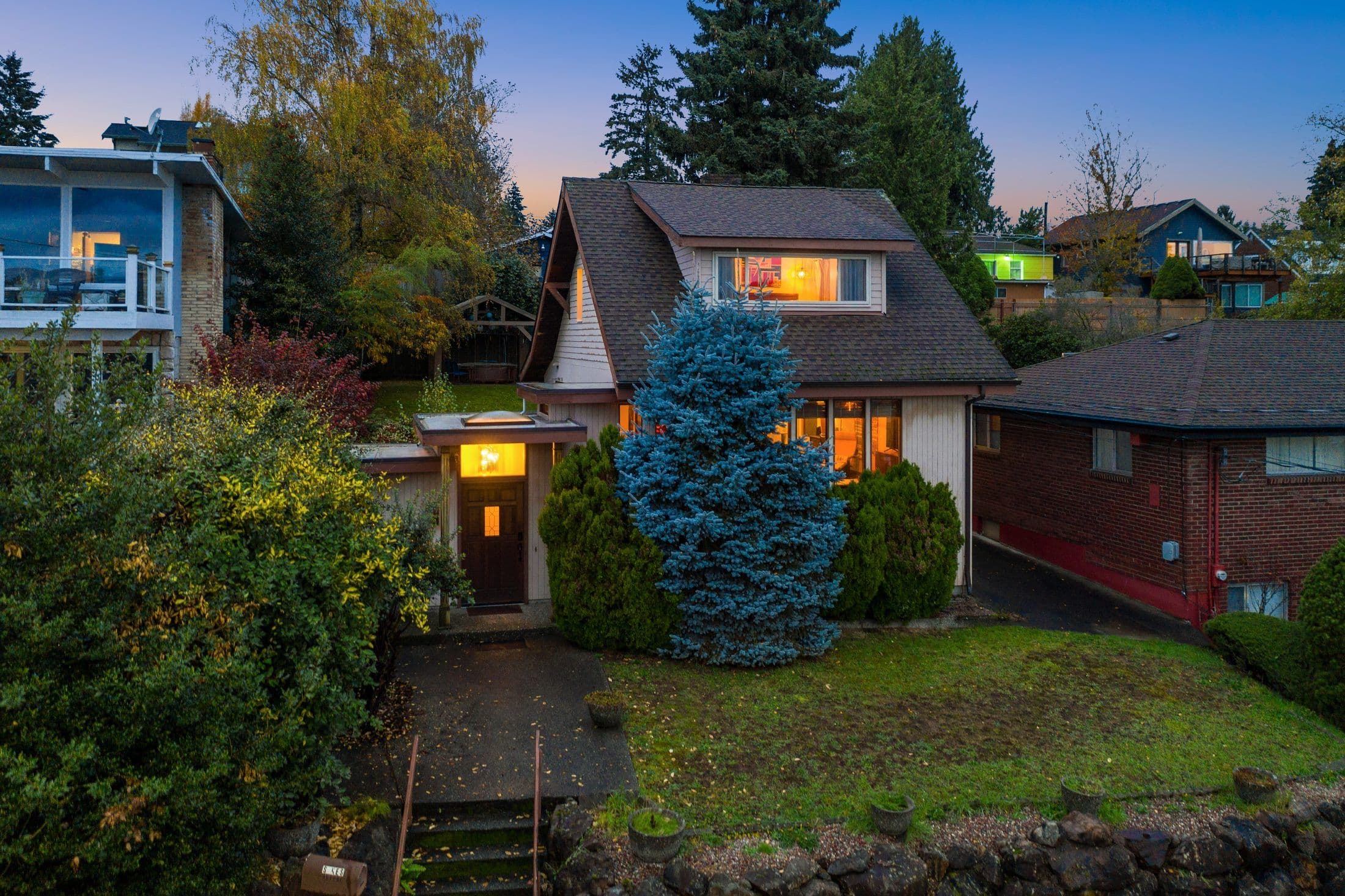 A close-in Puget Sound craftsman home at dusk