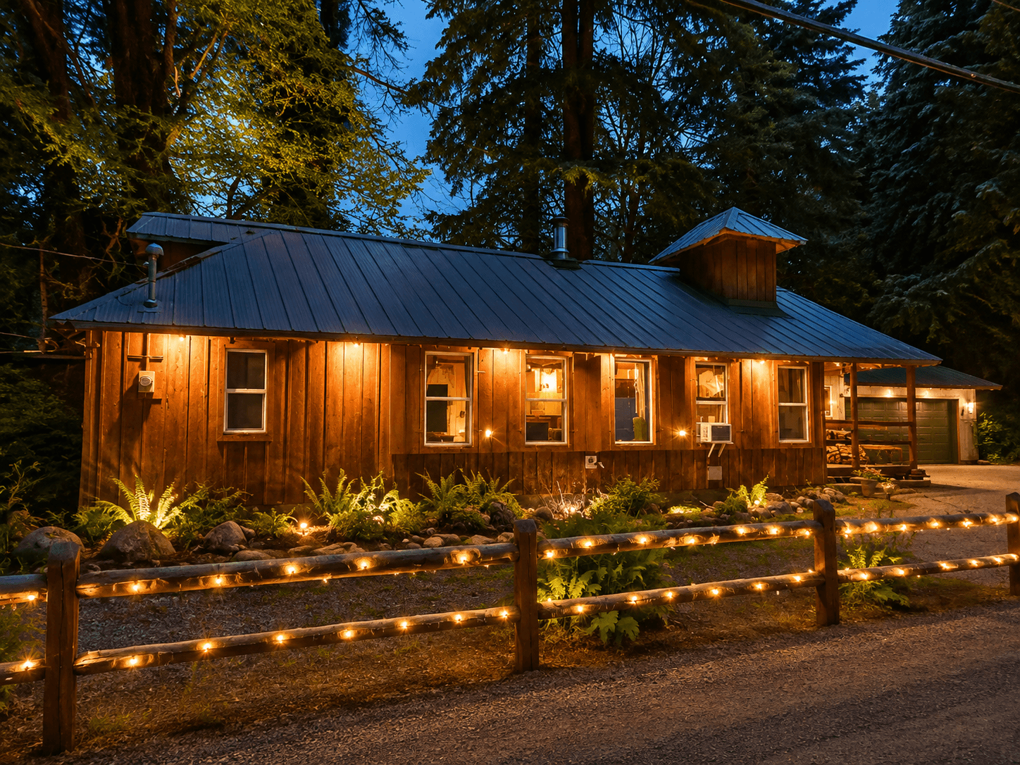 A short-term rental cabin lit up at twilight